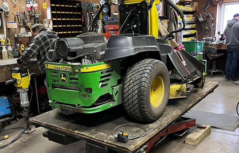 Ralph’s Lawn & Power sevice area working on a lawn mower